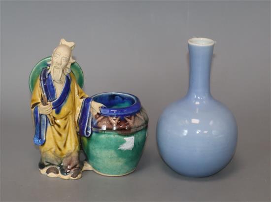 A Chinese blue glazed bottle vase, Kangxi mark but Republic period and a Chinese pottery figure tallest 12cm